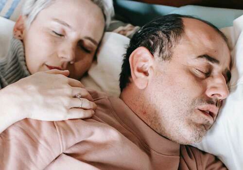 man snoring on right wife can't sleep on left