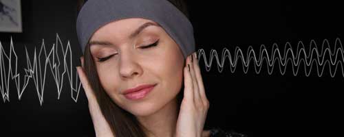 woman listening to binaural beats audio for sleep
