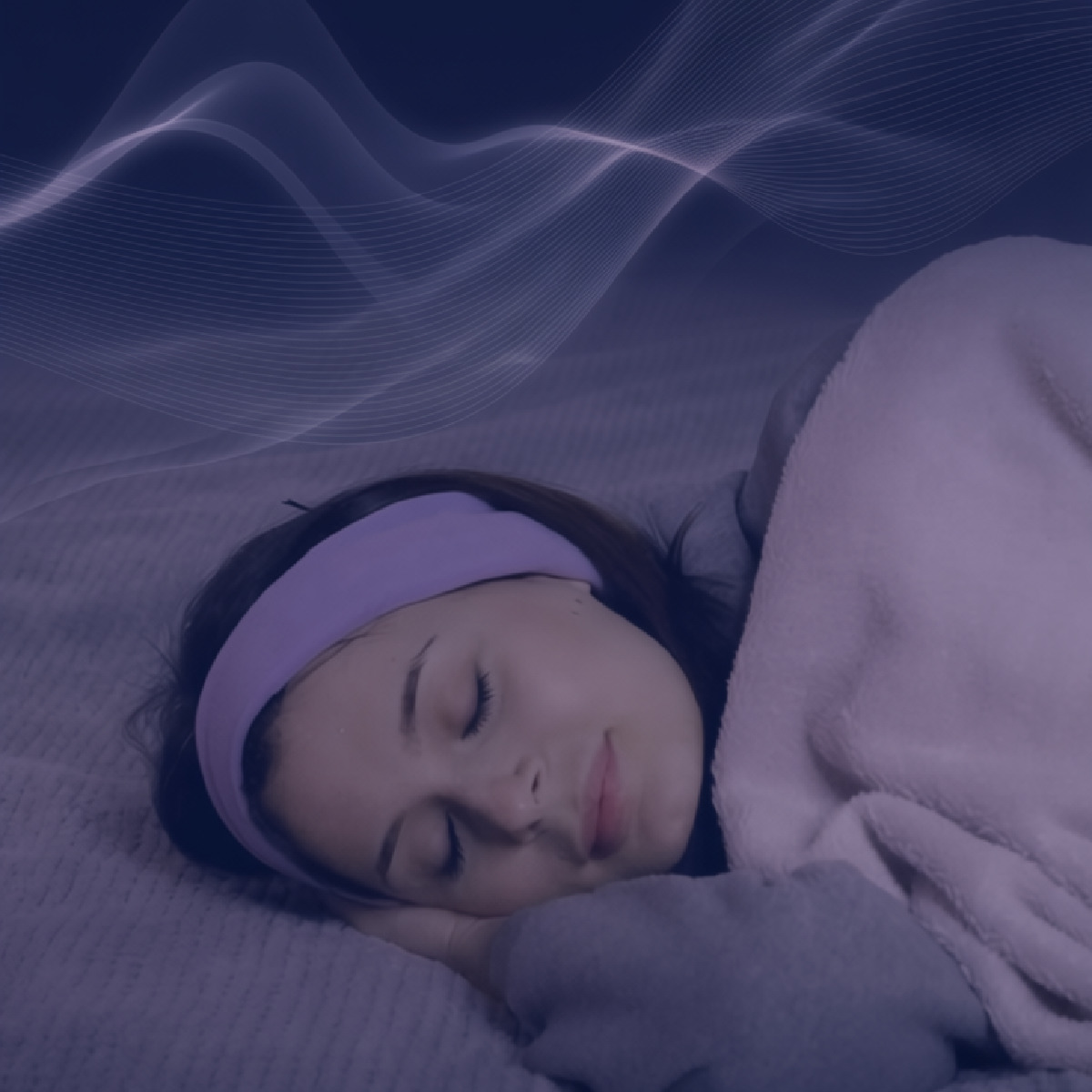 a woman using sound to mask disturbing noises using our SleepPhones® headphones