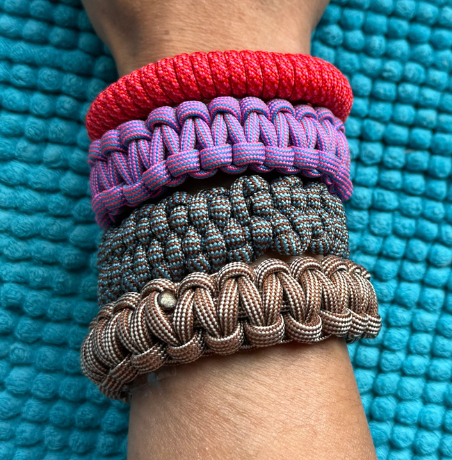 four paracord bracelets covering 3 inches of forearm