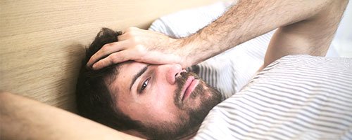 man struggling to manage shift work and sleep