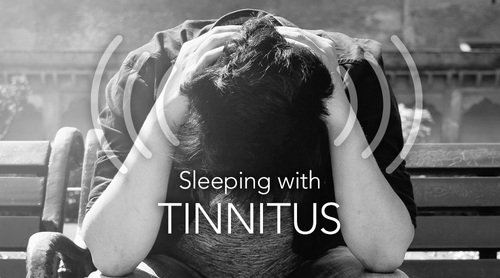 Sleeping with tinnitus. man with tinnitus frustrated because he can't fall asleep with tinnitus