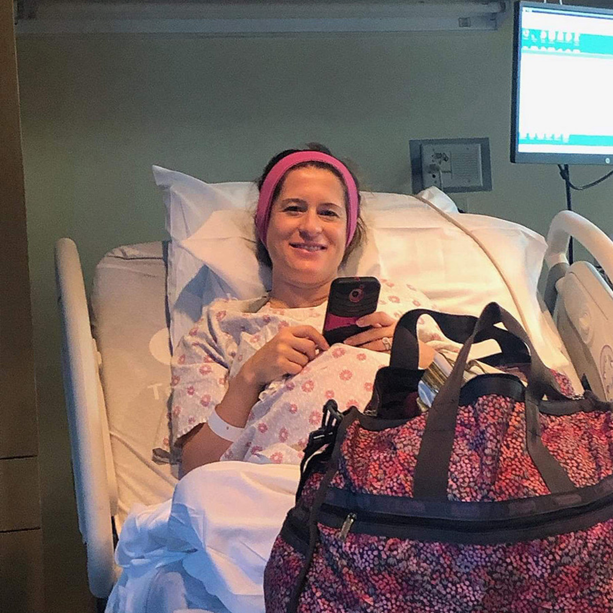 Woman using SleepPhones® comfortable headphones to play calming music for hypnobirthing