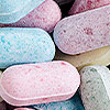 pink, blue, purple, and green daily vitamins