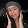 woman listening to binaural beats audio for sleep