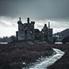 haunted structure against a darkening sky