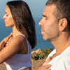 couple practicing autogenic training while at the beach together
