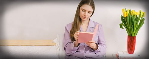 woman recording how much sleep she gets