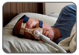 Man sleeping with a CPAP machine