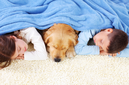 children asleep with dog