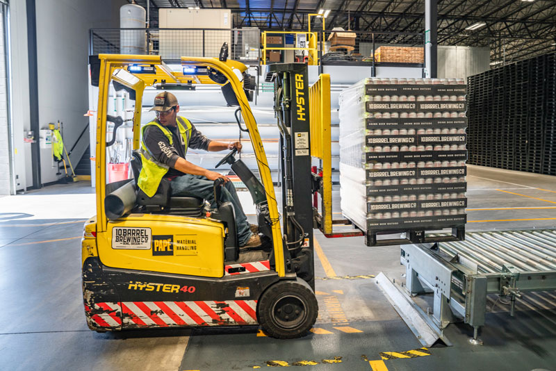 Man operating forklift in warehouse